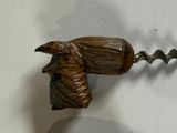 a bottle opener that has a horse head on it