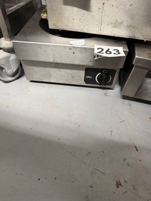 an image of a kitchen with a stove and a toaster oven