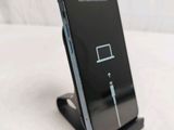 a cell phone that is charging on a stand