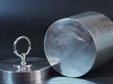 a silver container with a ring on it and a silver container with a ring on it