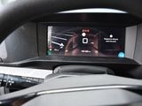 steering wheel of a car with a digital display on the dashboard