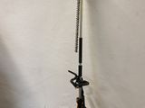 a close up of a small pole with a handle on the ground
