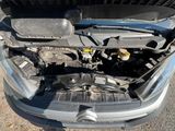 a car with its hood open and the engine in the trunk