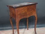 an image of a small wooden table with a drawer on top of it