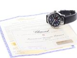 a watch sitting on top of a certificate on a table