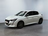 a white car is parked in a room with a white wall