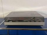 a turntable sitting on top of a glass table