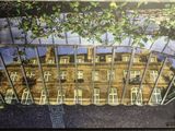 une image représentant une photo d'un bâtiment avec une clôture devant