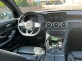 the interior of a car with a steering wheel, dashboard, and dashboard controls