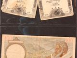 two old german bank notes with a picture of a man and a woman