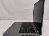 an open laptop computer sitting on top of a white surface