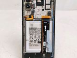 a picture of a cell phone with a battery attached to it