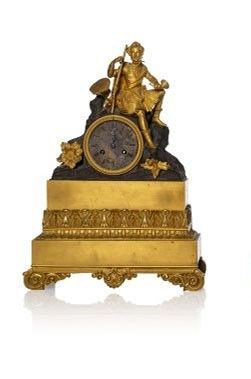 two clocks that are sitting side by side on a white surface