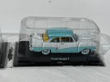 two toy cars in a clear case on a white surface