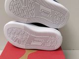 a close up of a pair of shoes on top of a red box