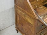 a wooden desk with a mirror on top of it