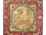 une tapisserie brodée représentant un homme et un chien