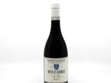 a bottle of wine that is sitting on a table