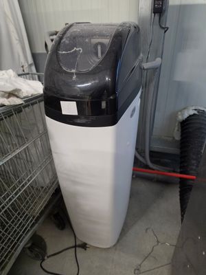 une photo d'un filtre à eau dans un garage
