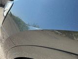 a black car parked on the side of the road