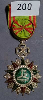 a medal with a ribbon around it and a medal with a ribbon around it