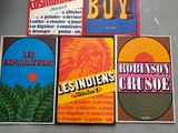 several posters of various types of music are displayed on a table