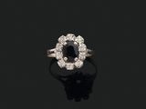 a black diamond and diamond cluster ring