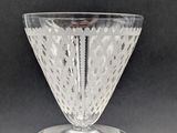 clear glass vase with a clear base on a black background