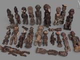 a lot of wooden figurines that are sitting on a table