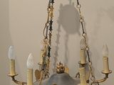 a chandelier hanging from the ceiling in a room
