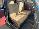 a seat in the back of a car that is dirty