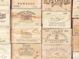 many wooden wine boxes stacked on top of each other