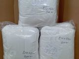 boxes of toilet paper stacked on top of each other in a room