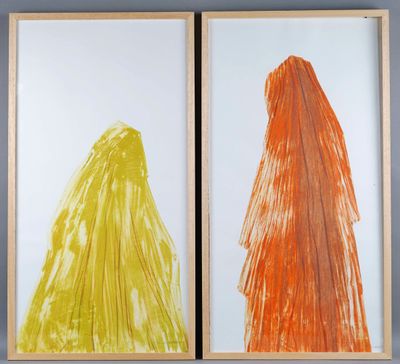 two framed paintings of orange and yellow trees on a blue wall