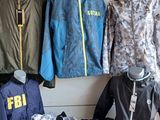 many different jackets and jackets on display in a store