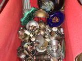 a red table with a bunch of silver items in it