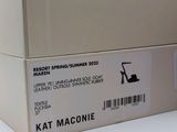 a white box with a label on it that says katt macone