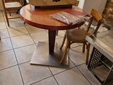 a table with a pizza box on it in the middle of a room