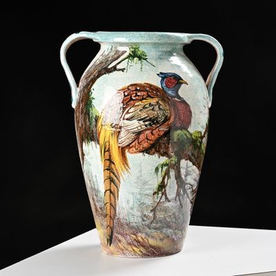 a vase with a painting of a pheasant and a pheasant on it