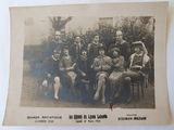 an old photo of a group of people posing for a picture