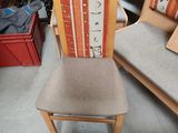 two chairs that are sitting next to each other in a room
