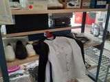a room with a lot of items on the shelves