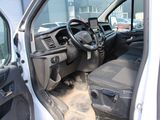 a white van with a steering wheel and a black seat