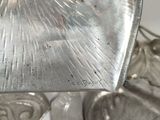 a silver object that is sitting on a table
