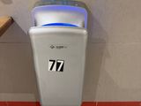 a paper towel dispenser in a public restroom