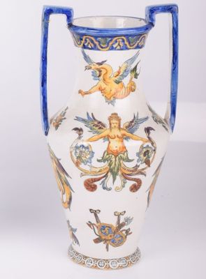 a white vase with a blue handle on a white background