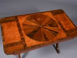 an image of a wooden table with a circular design on it