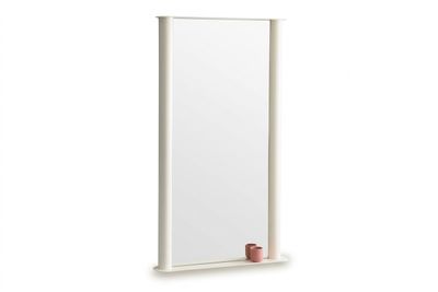 an image of a tall mirror with a candle on the shelf