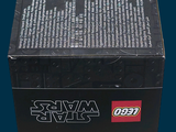 a box of legos sitting on a blue surface