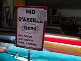 a sign that says nid diabelle 1260 on it in front of a row of beds